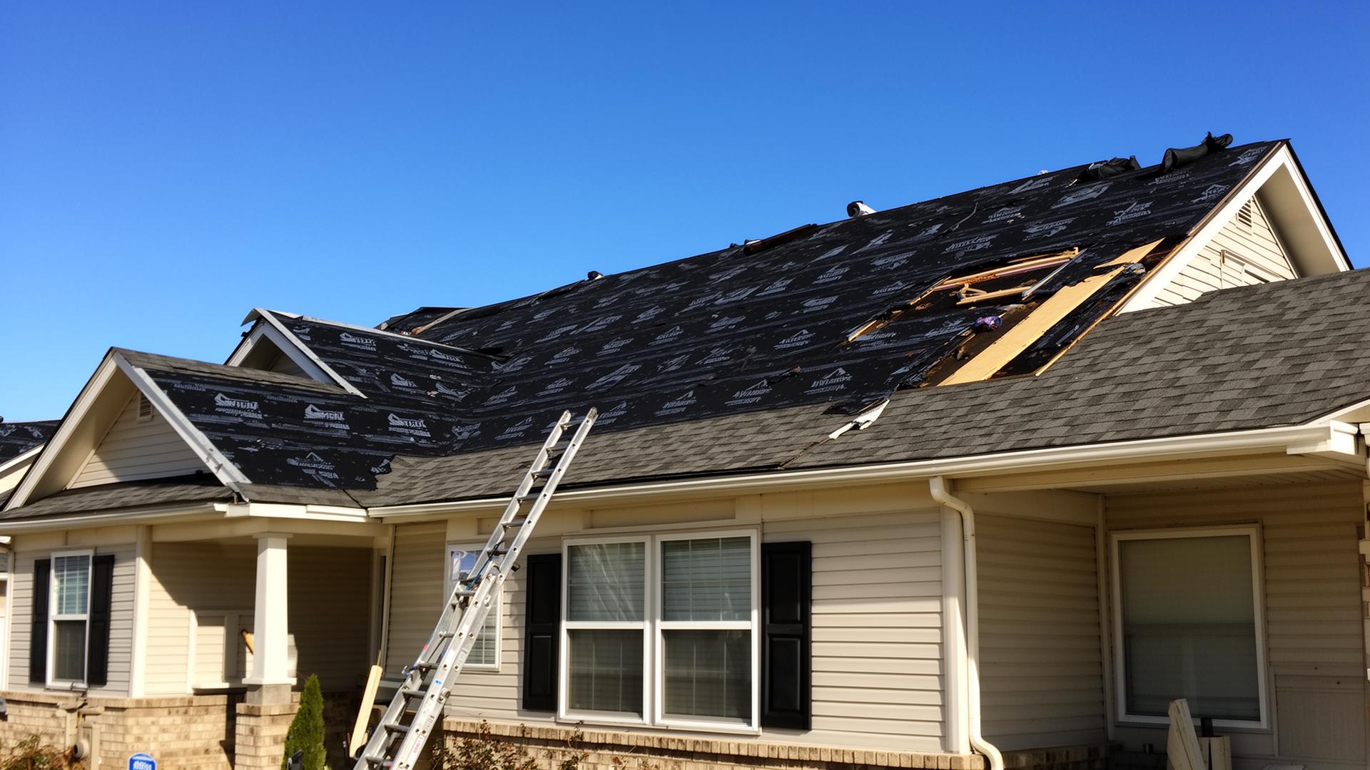 Roof mid-replacement with fresh underlayment